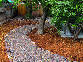 Rock Path Curving Through Mulch 