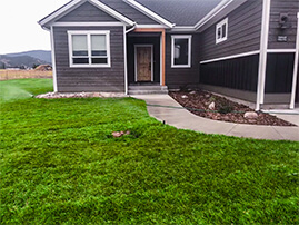 Small Mulch Area Between Driveway and Front Walkway.