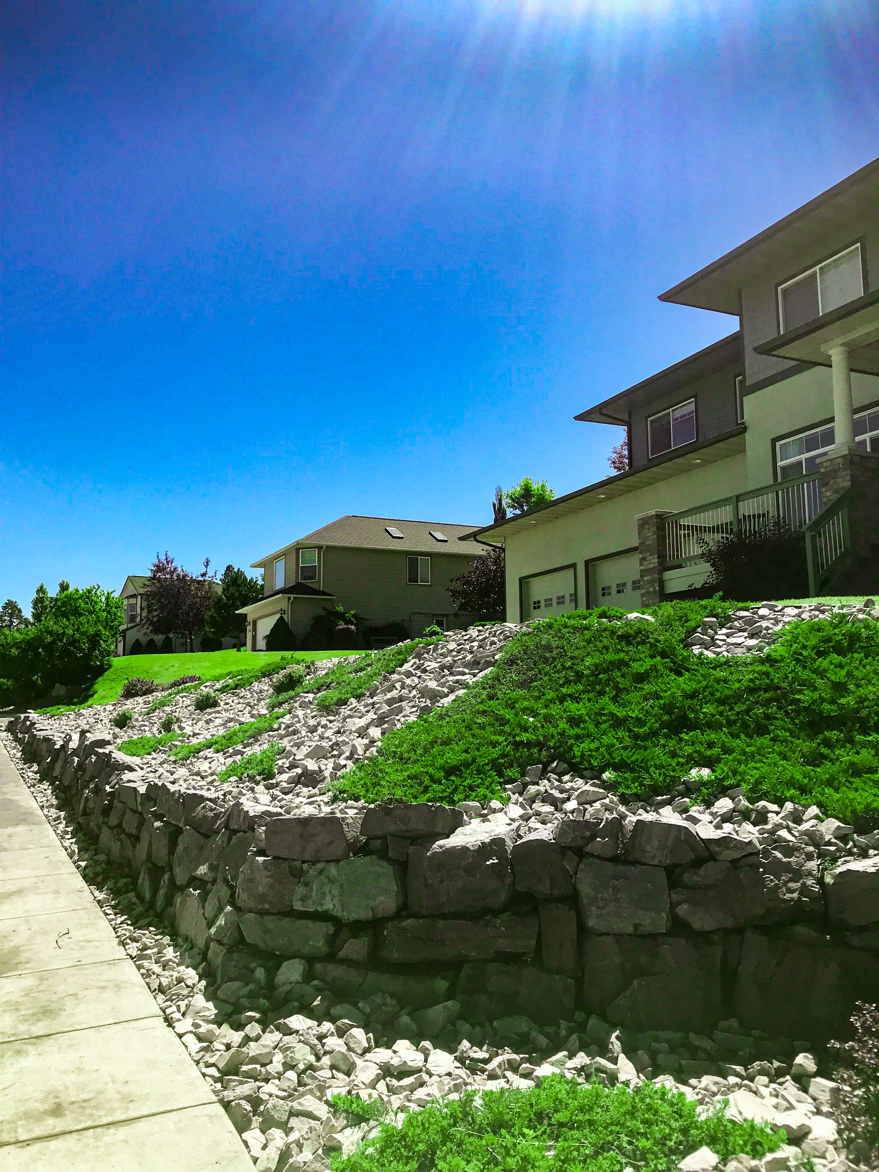 Stone Retaining Wall With Bushes